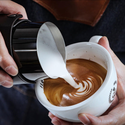 KNODOS Handleless Milk Frothing Pitcher 14oz – PVD Coated Stainless Steel Latte Art Pitcher with Real Leather Sleeve, Premium Espresso Coffee Steaming Cup (Black)